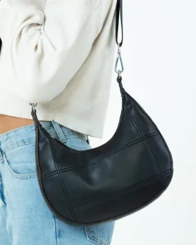 Curved Quilted Leather-Look Sling Crossbody Bag in Black